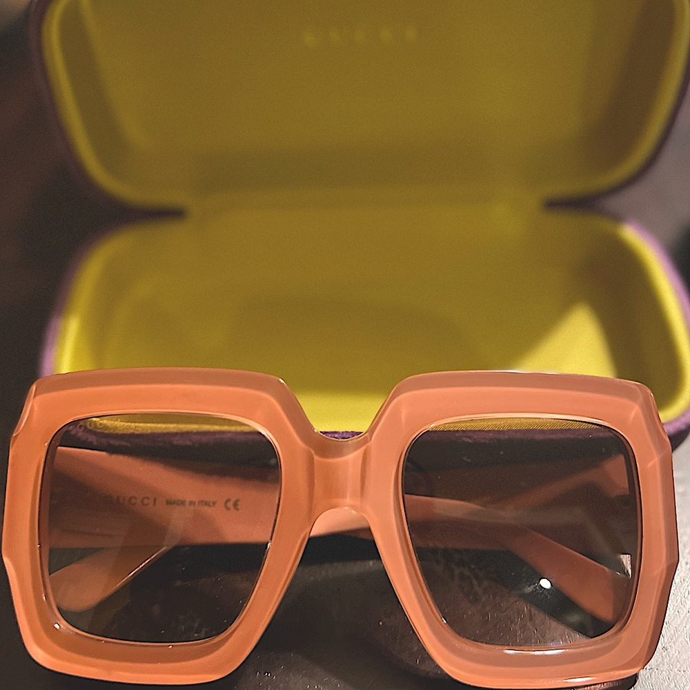Pink Gucci oversized square sunglasses with acetate frames.